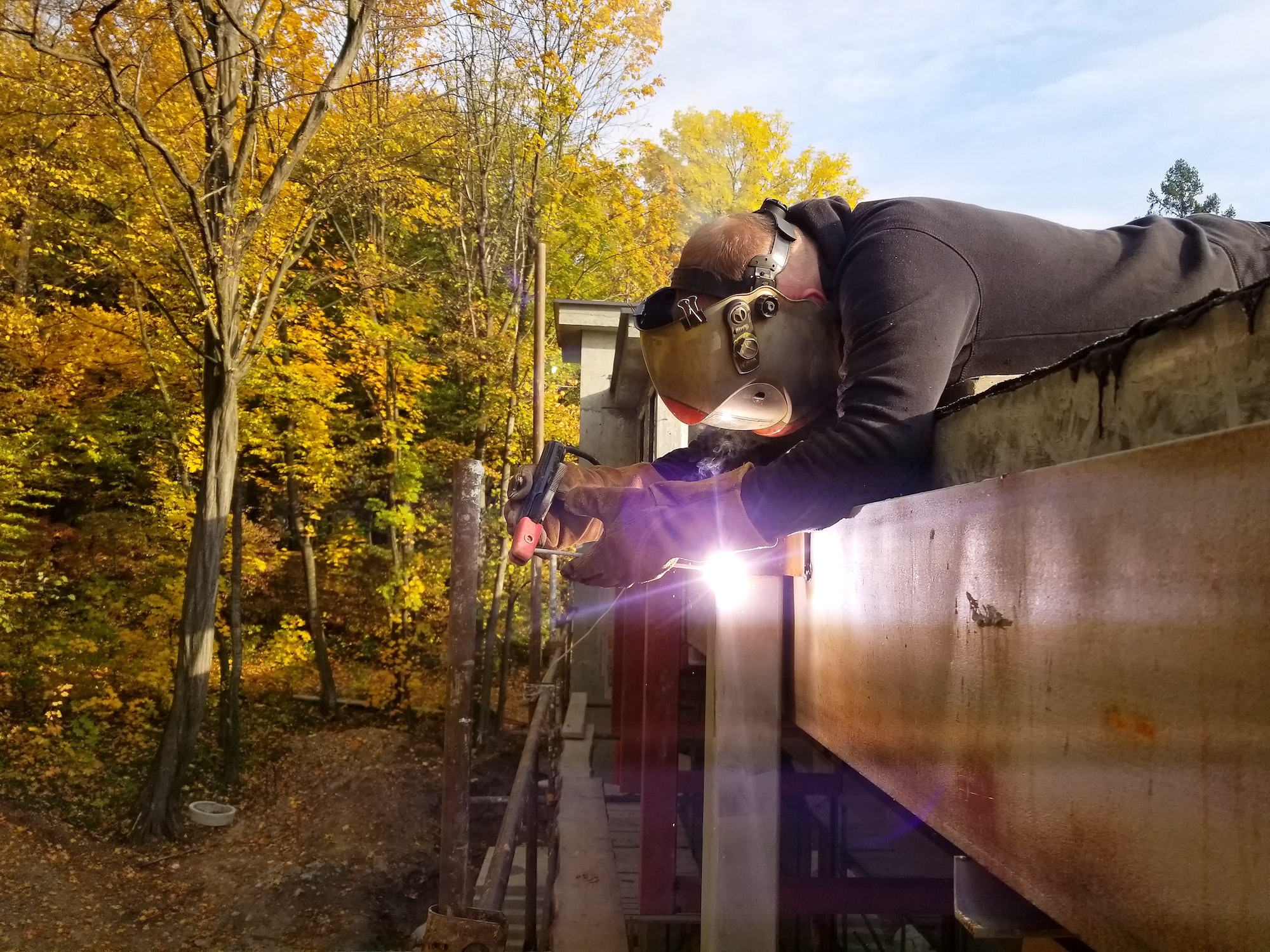 Worker welding in a factory. Welding on an industrial plant.