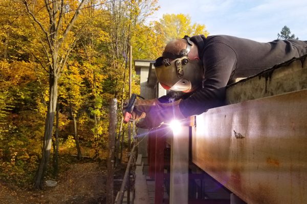 Worker welding in a factory. Welding on an industrial plant.